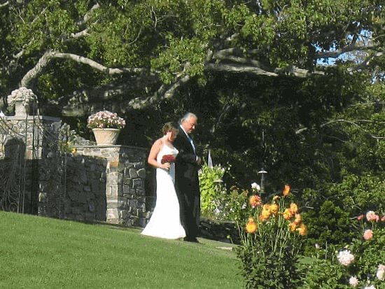 Father walking bride to wedding ceremony